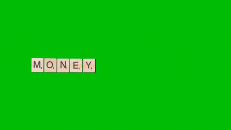 Stop-Motion-Business-Concept-Above-Desk-Wooden-Letter-Tiles-Forming-Word-Money-1